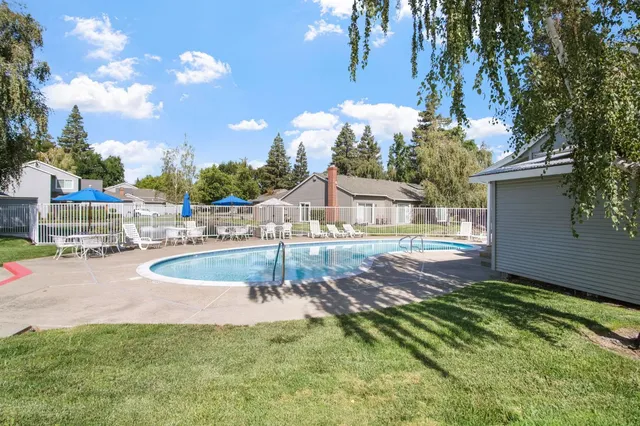 a view of a house with swimming pool
