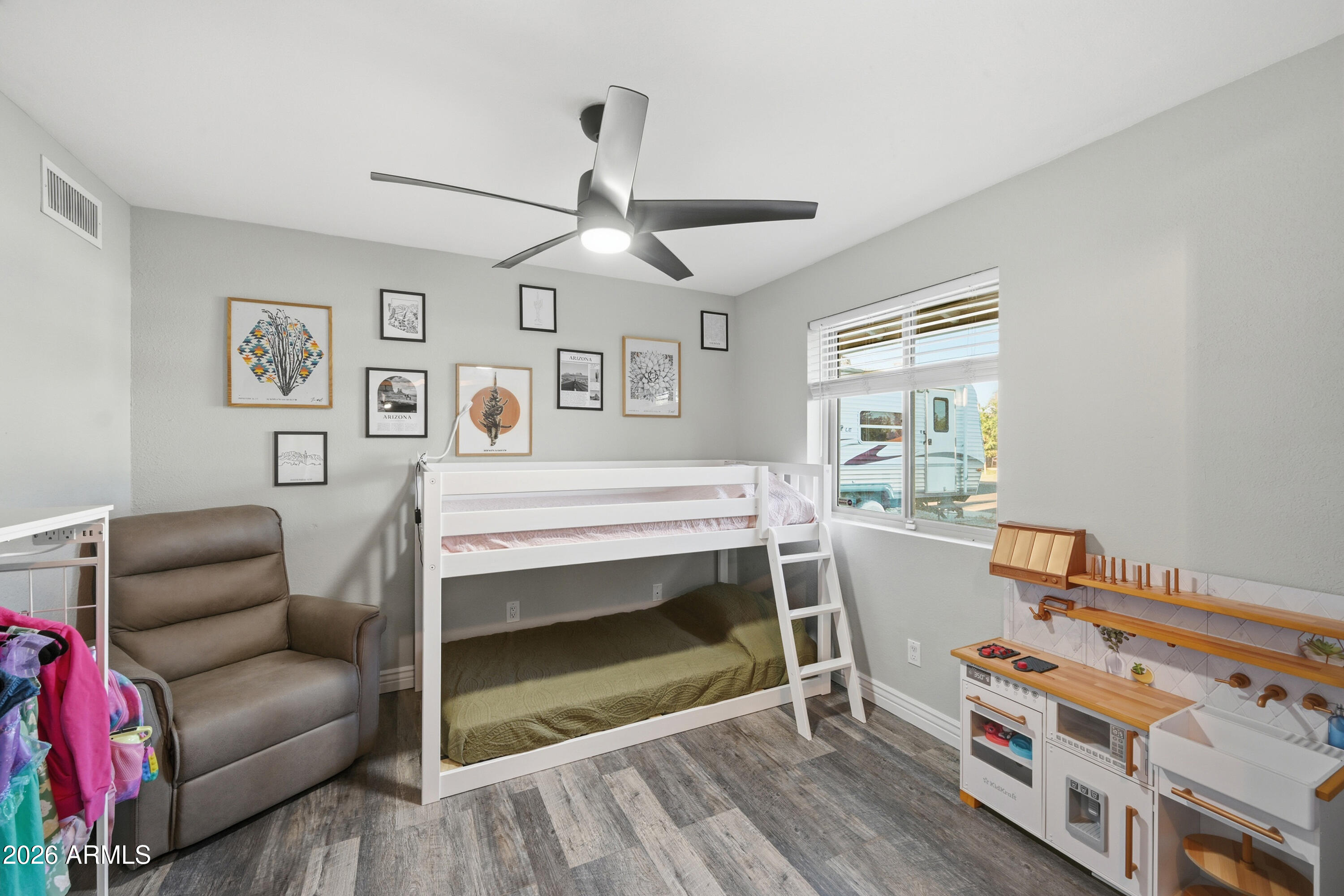436 North Larkspur Street Gilbert, AZ 85234 - Photo 11 of 31 a bedroom with furniture and a wooden floor