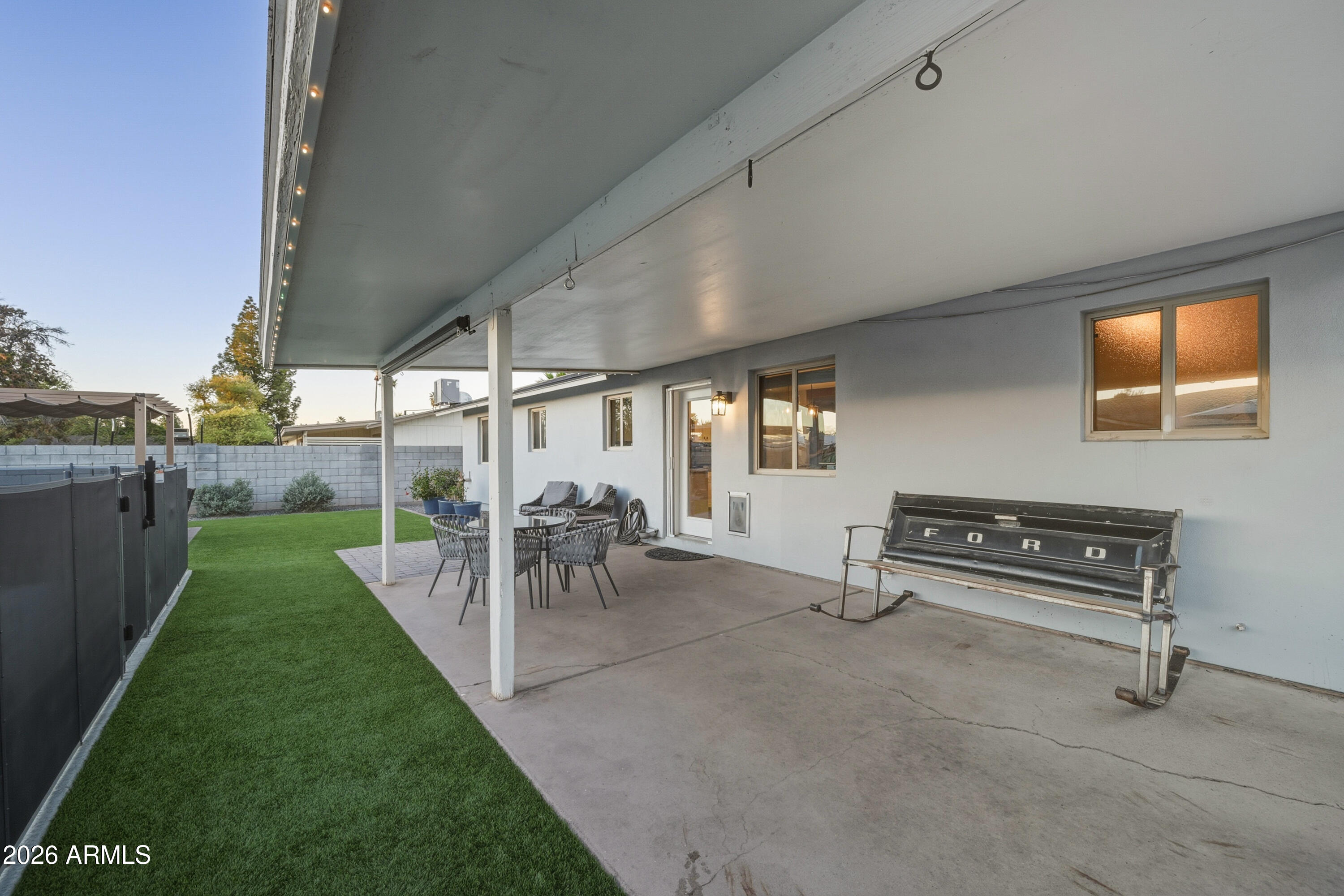 436 North Larkspur Street Gilbert, AZ 85234 - Photo 27 of 31 a view of a patio with a table and chairs