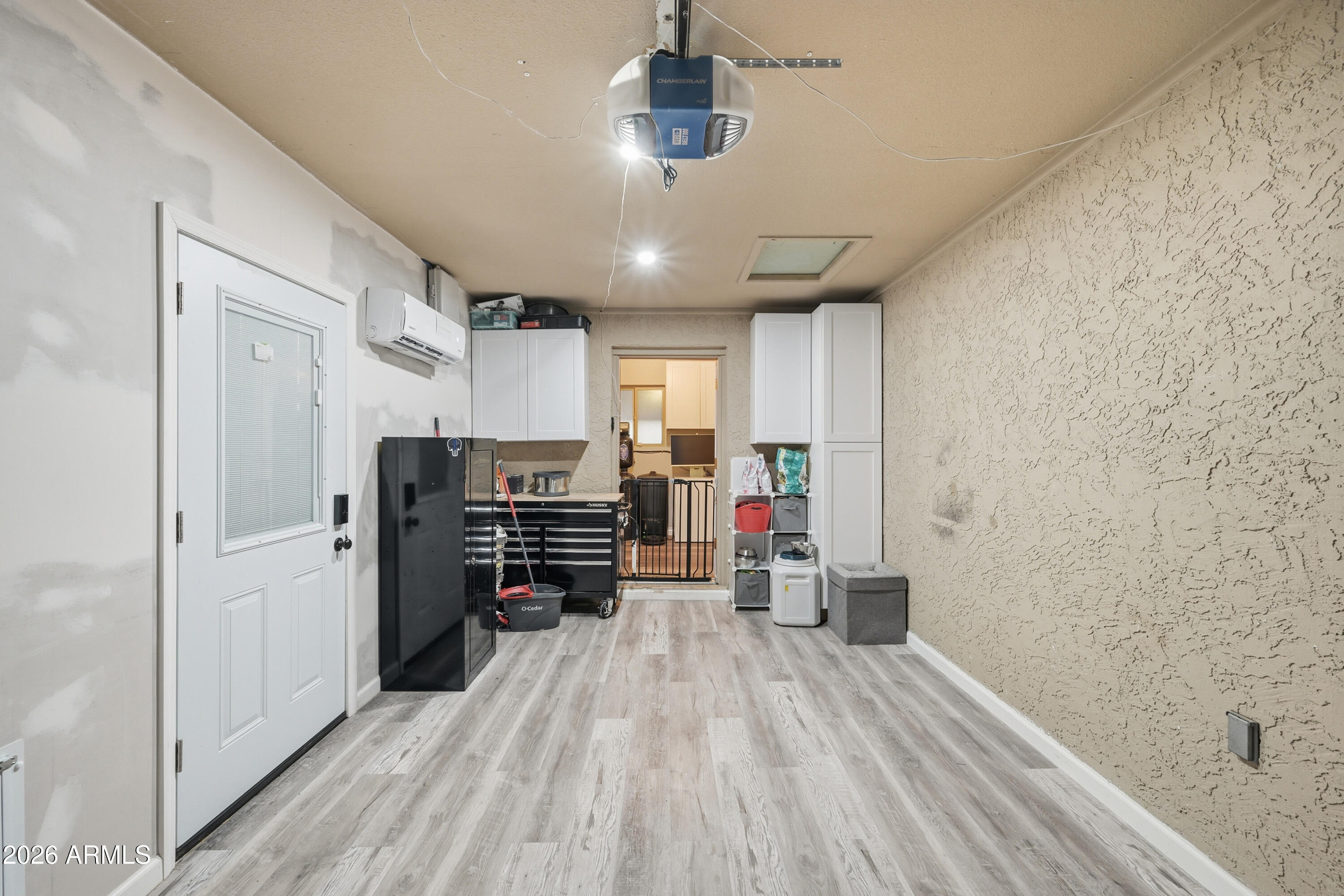 436 North Larkspur Street Gilbert, AZ 85234 - Photo 28 of 31 a view of a kitchen with a refrigerator a ceiling fan and wooden floor