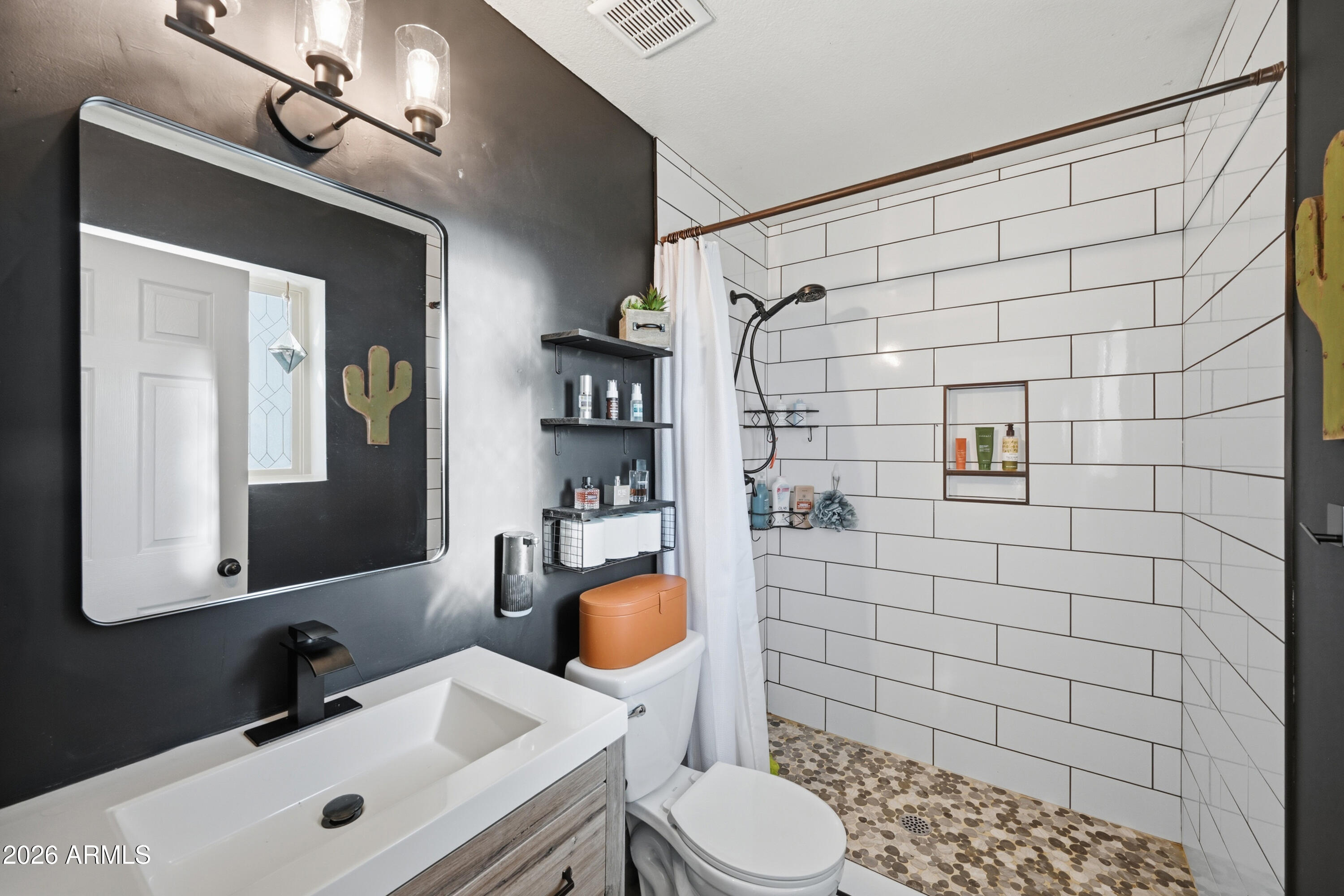 436 North Larkspur Street Gilbert, AZ 85234 - Photo 9 of 31 a bathroom with a sink toilet and shower