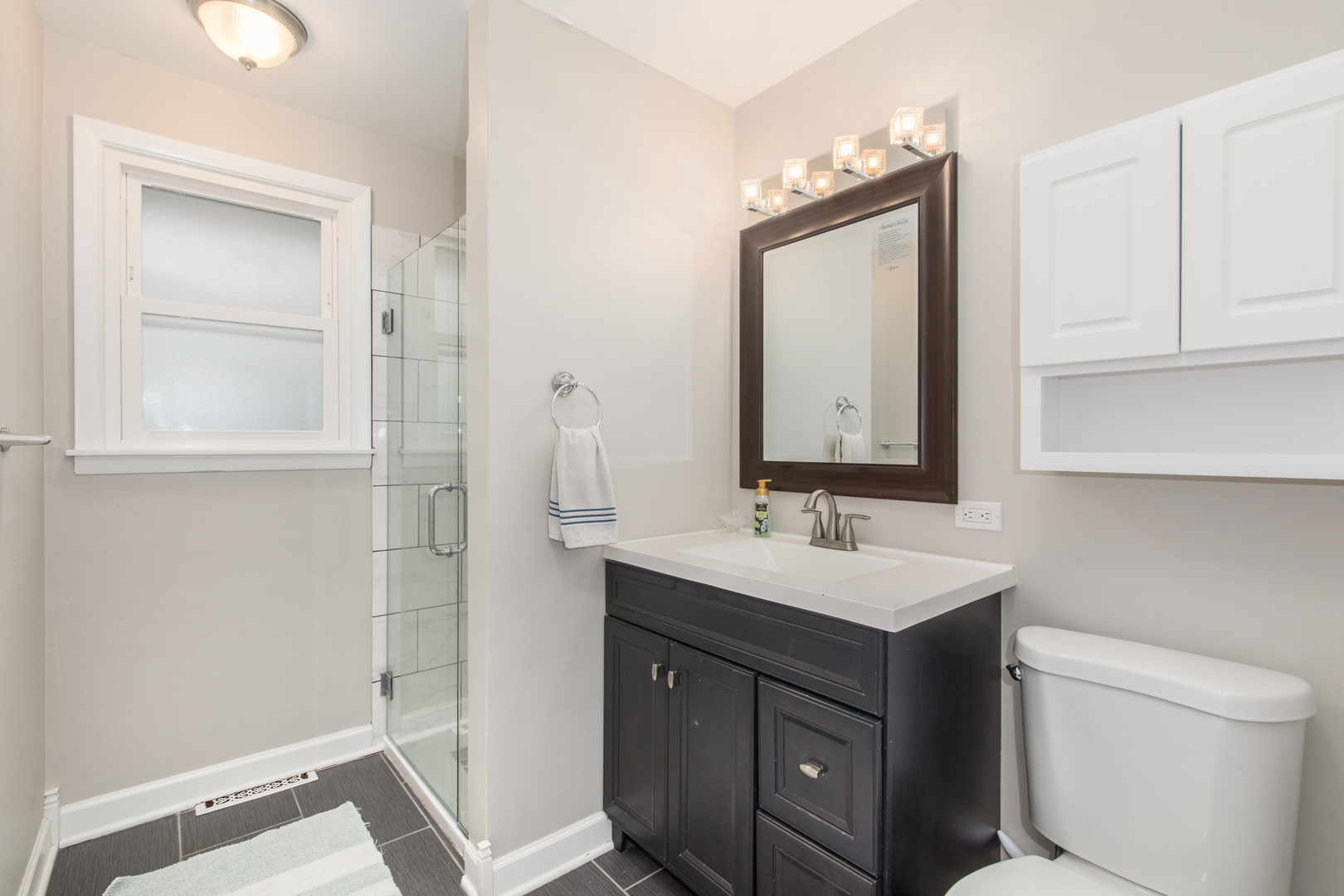 2005 Cayuga Lane Mount Prospect, IL 60056 - Photo 13 of 28 a bathroom with a sink a vanity and a mirror