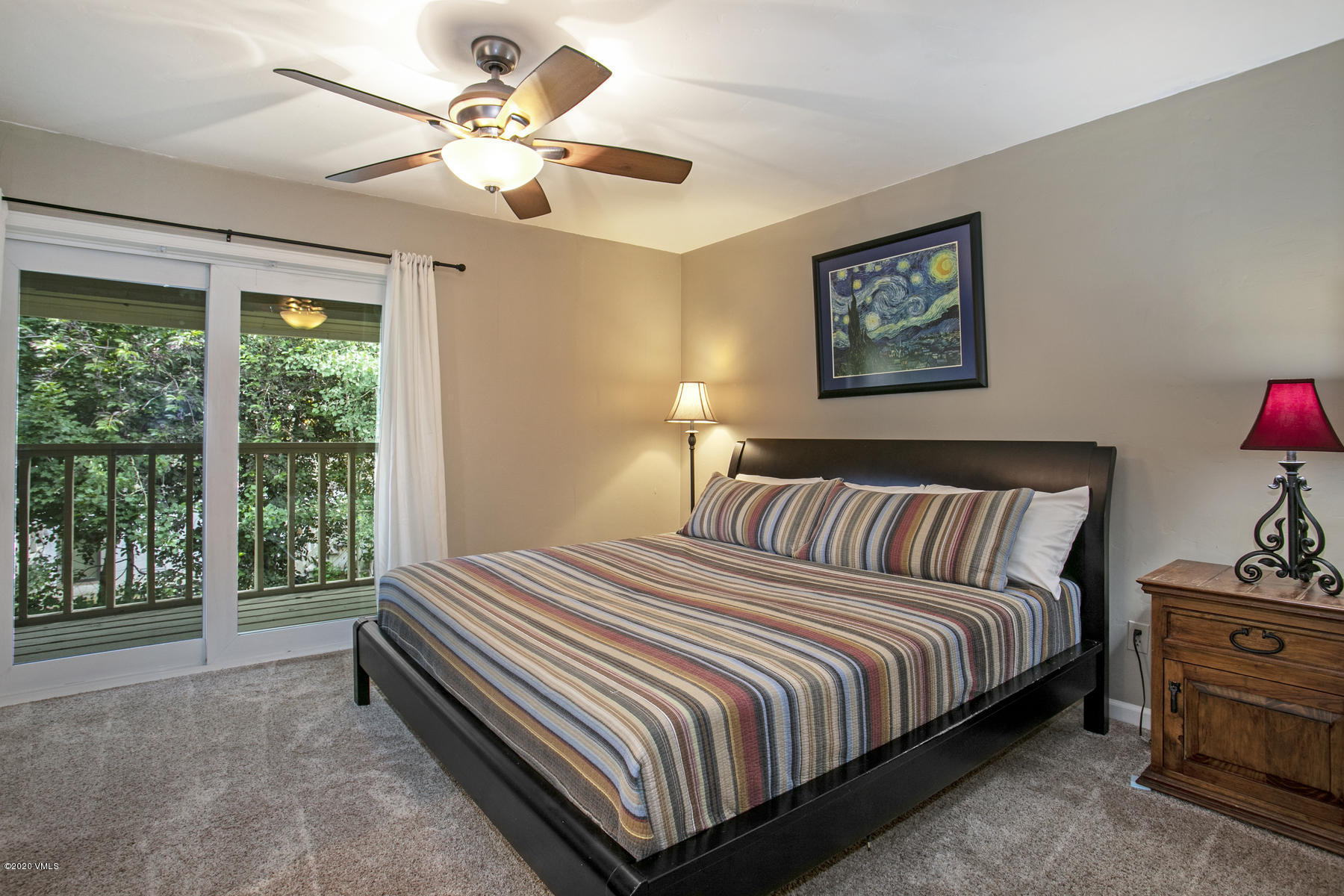 124 Eagle Road, Unit C Avon, CO 81620 - Photo 13 of 35 a bedroom with a bed and a large window