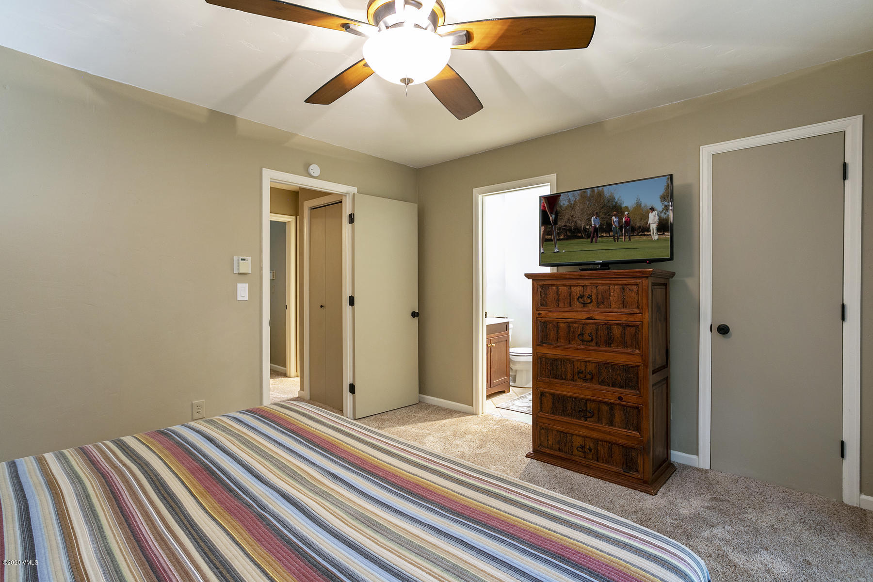 124 Eagle Road, Unit C Avon, CO 81620 - Photo 14 of 35 an empty room with closet and ceiling fan