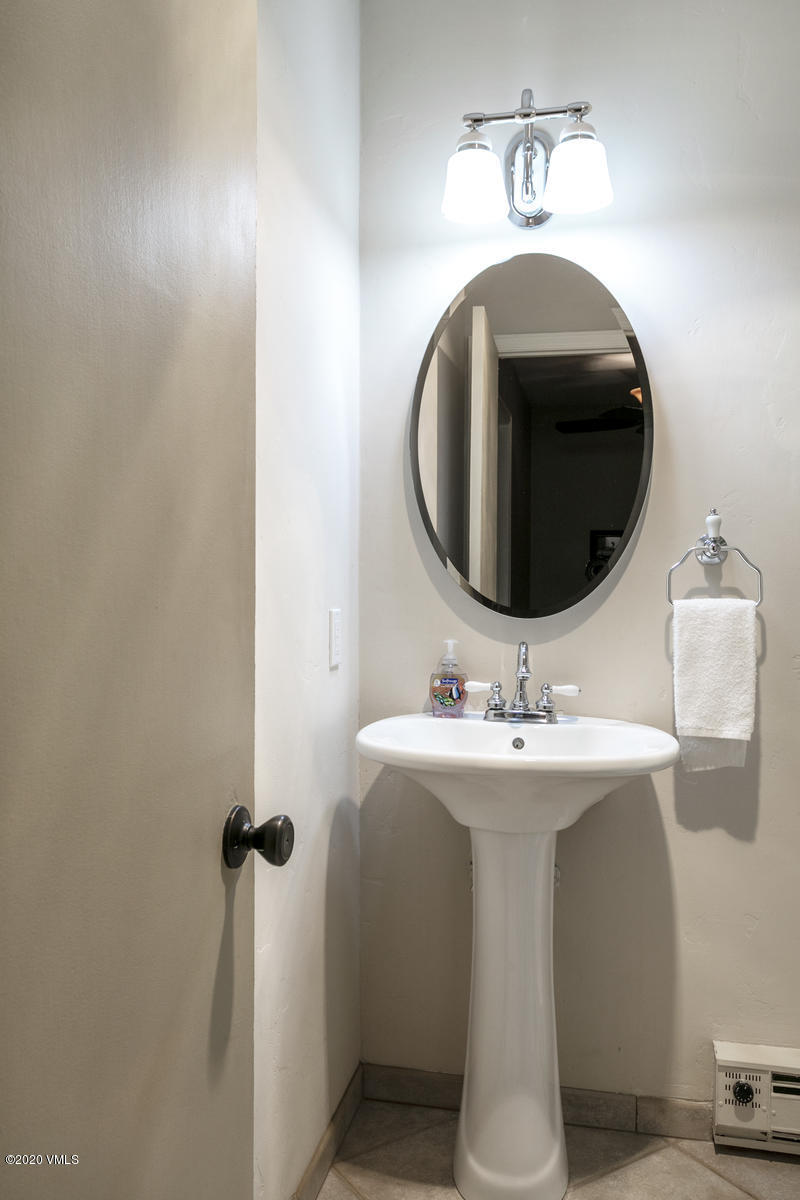 124 Eagle Road, Unit C Avon, CO 81620 - Photo 19 of 35 a bathroom with a sink and mirror