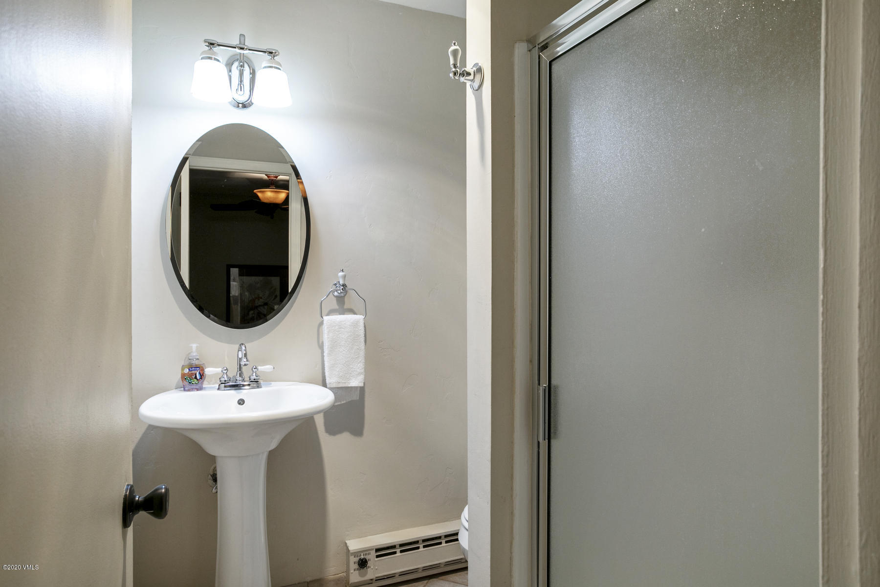 124 Eagle Road, Unit C Avon, CO 81620 - Photo 20 of 35 a bathroom with a sink and mirror