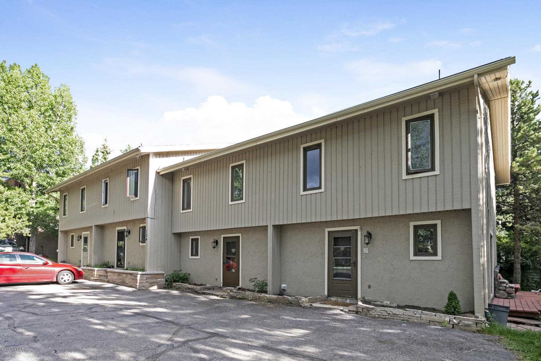 124 Eagle Road, Unit C Avon, CO 81620 - Photo 2 of 35 a front view of a house with a yard