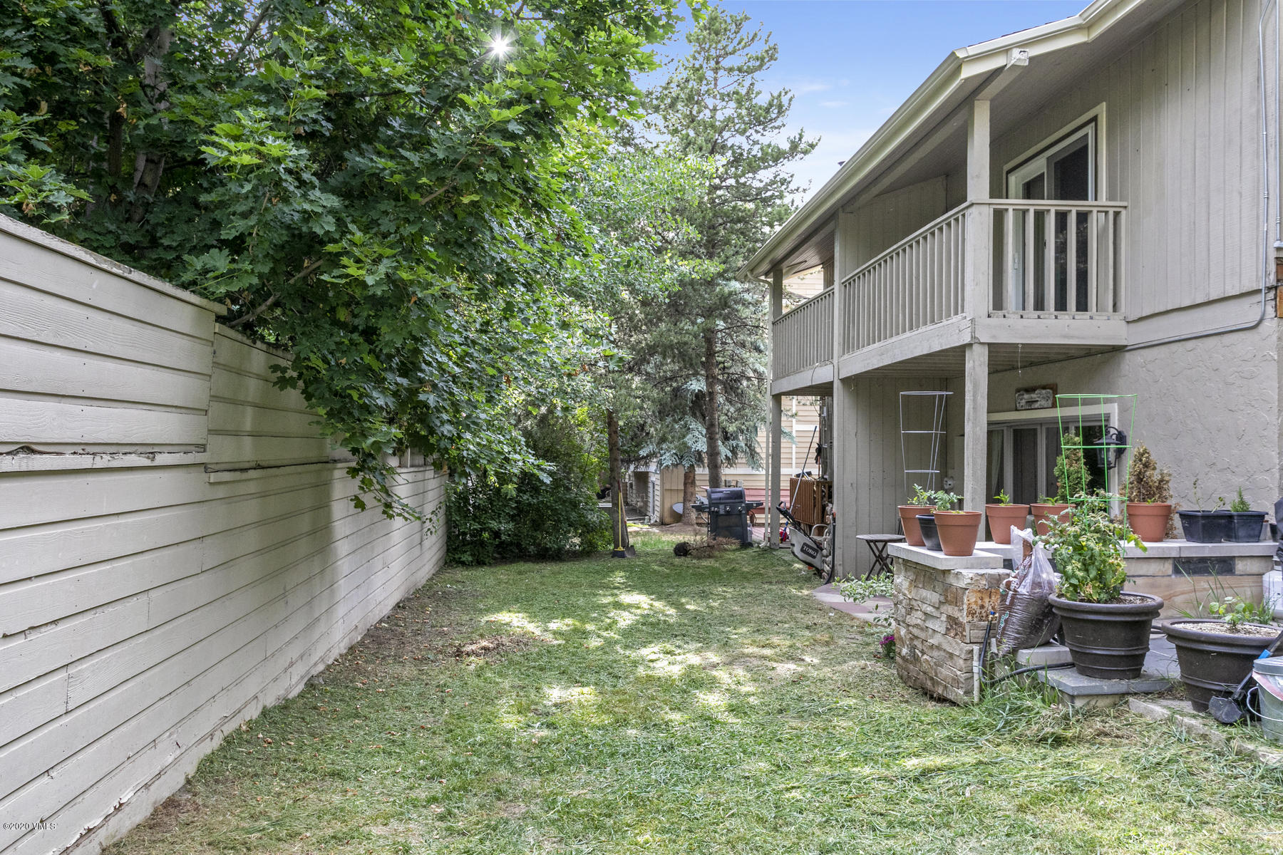 124 Eagle Road, Unit C Avon, CO 81620 - Photo 24 of 35 a backyard of a house with seating space
