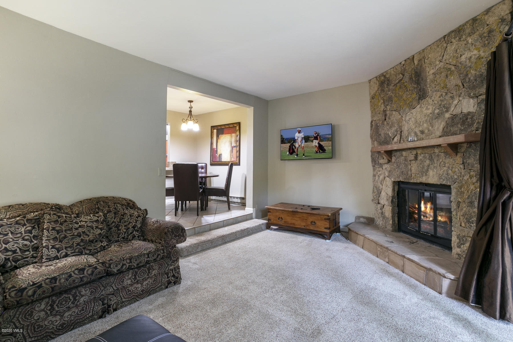 124 Eagle Road, Unit C Avon, CO 81620 - Photo 4 of 35 a living room with furniture and a fireplace
