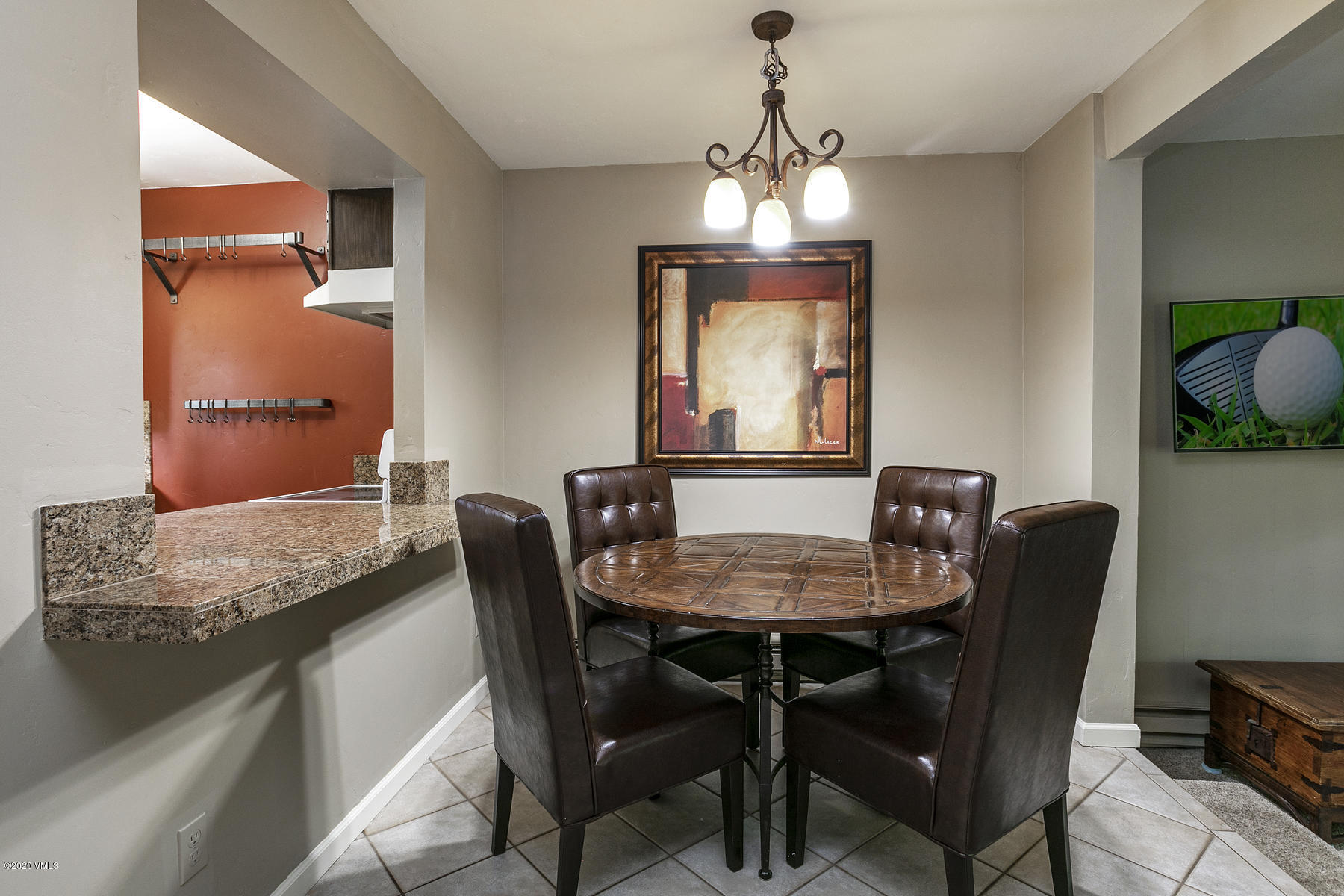 124 Eagle Road, Unit C Avon, CO 81620 - Photo 8 of 35 a view of a dining room with furniture and chandelier