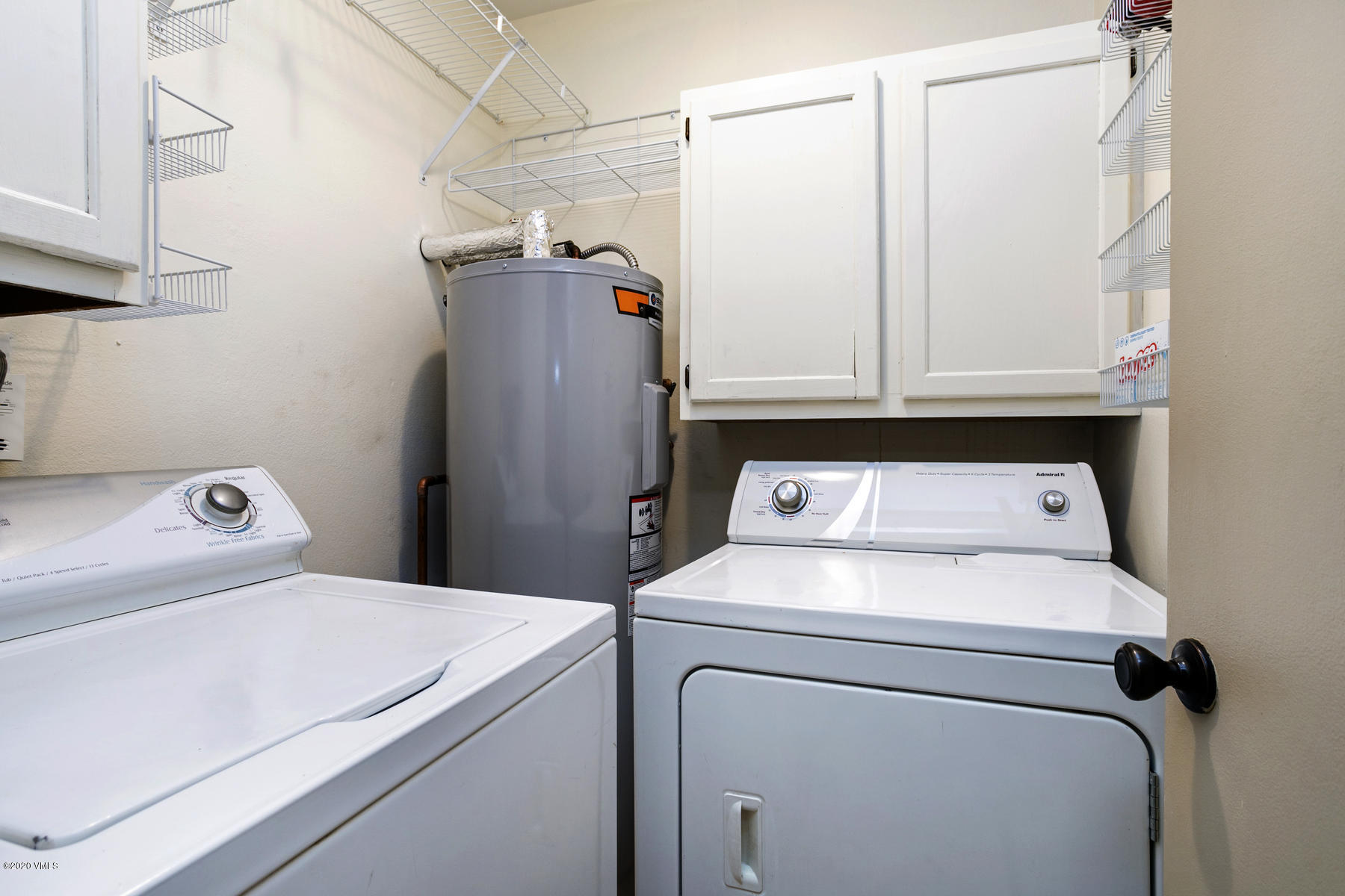 124 Eagle Road, Unit C Avon, CO 81620 - Photo 9 of 35 a utility room with dryer and washer
