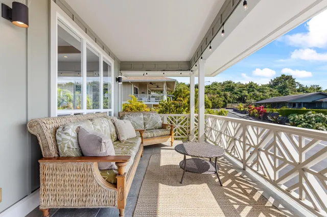 a bathroom with a toilet sink vanity and mirror