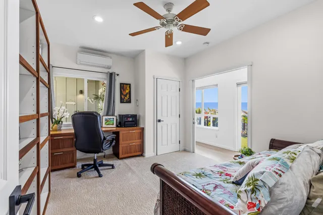 a bathroom with a granite countertop sink a toilet a mirror and shower