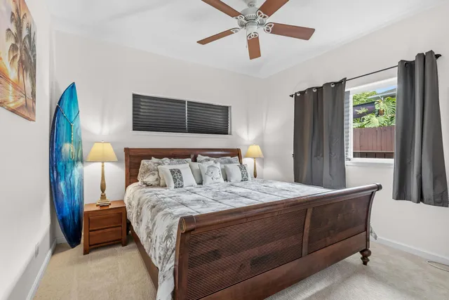 a spacious bedroom with a bed and a couch