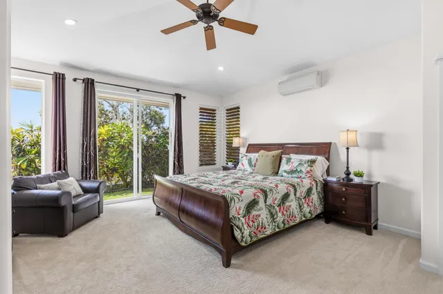 a spacious bathroom with a granite countertop sink and a mirror