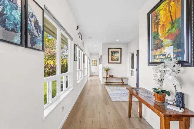 a view of an entryway with wooden floor