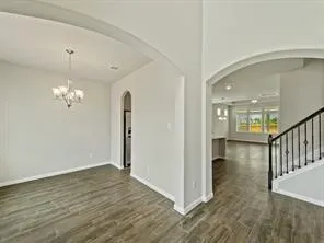 a view of a livingroom with wooden floor