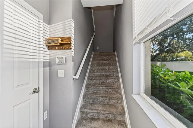 a view of a balcony with wooden floor and stairs