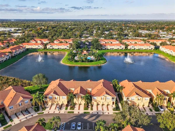 aerial view of a house with a lake view
