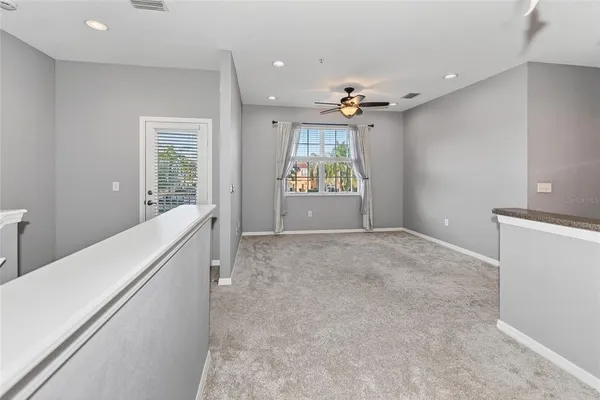 a view of a kitchen with a sink and a window
