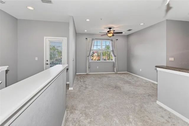 a view of a kitchen with a sink and a window