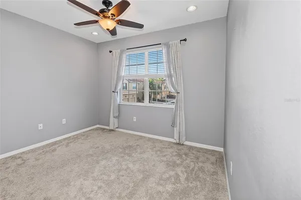 a kitchen with stainless steel appliances granite countertop a refrigerator a stove a sink and a cabinets