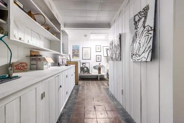 a kitchen with stainless steel appliances a sink and a refrigerator