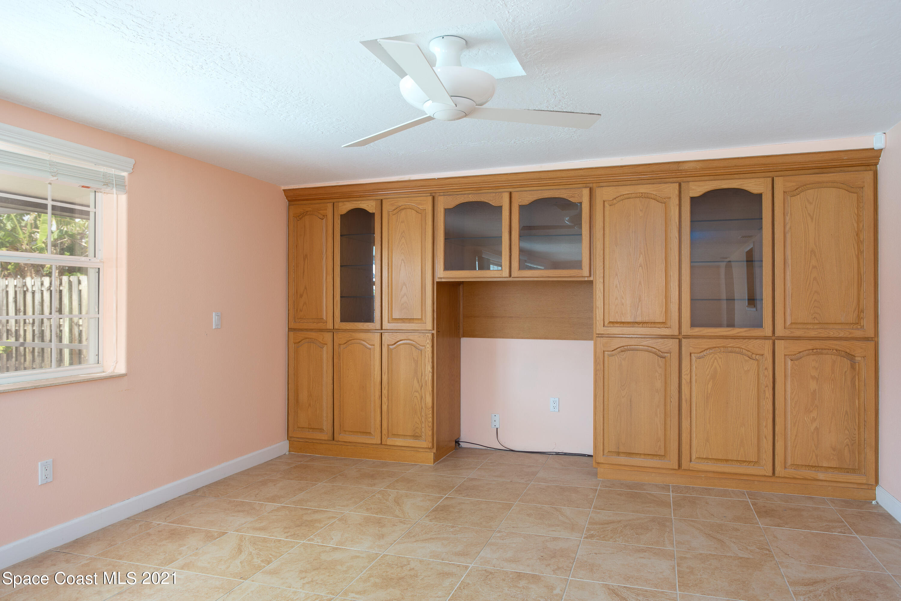 370 Capri Road Cocoa Beach, FL 32931 - Photo 11 of 21 an empty room with windows