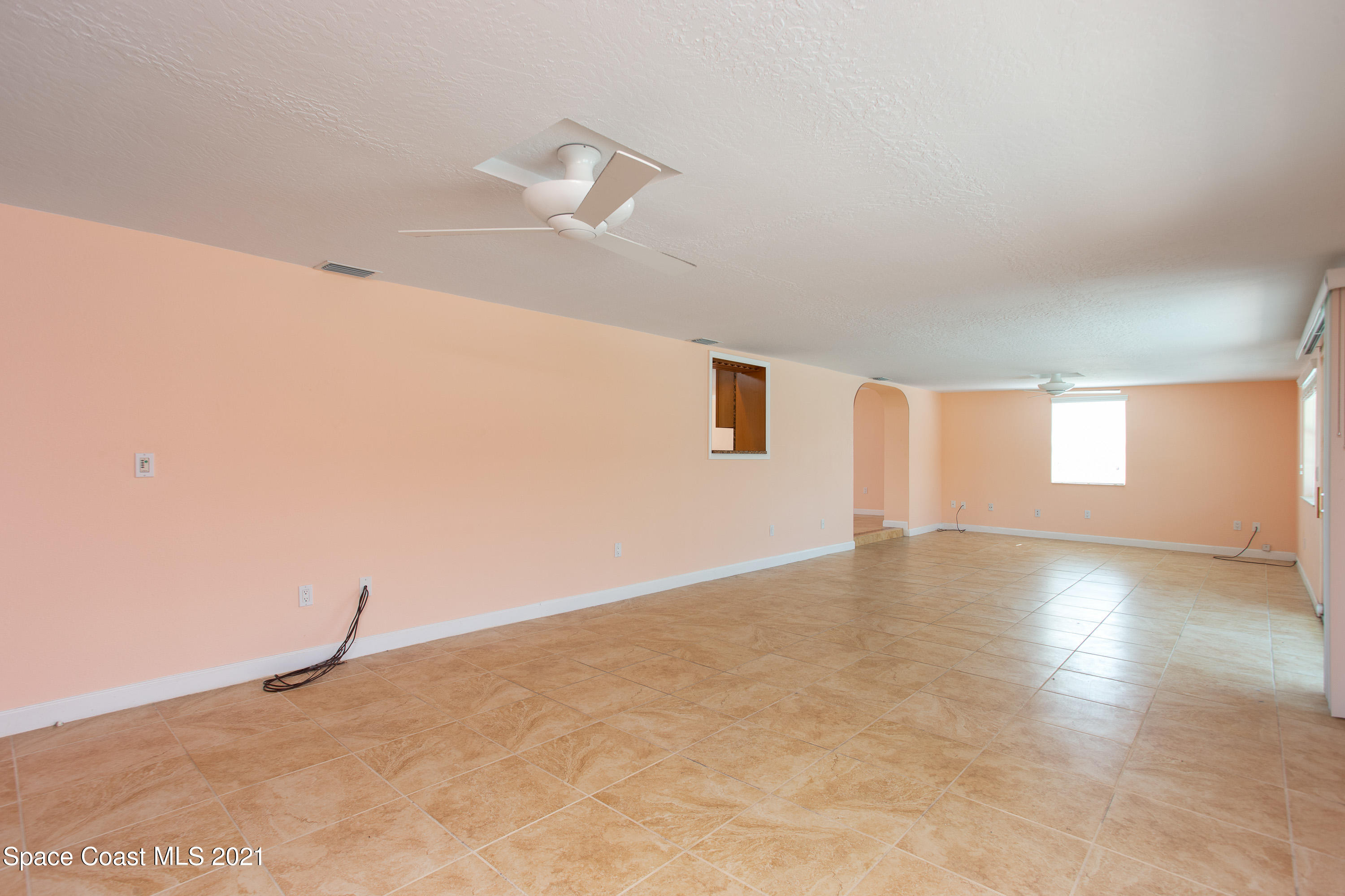 370 Capri Road Cocoa Beach, FL 32931 - Photo 12 of 21 a view of an empty room with a window