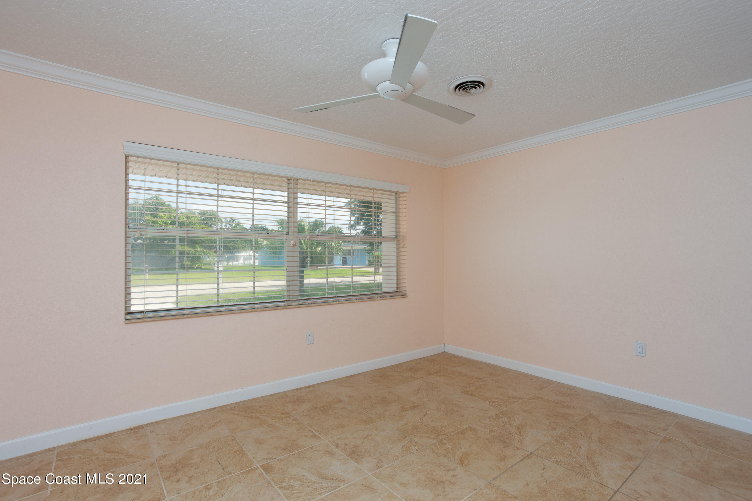 370 Capri Road Cocoa Beach, FL 32931 - Photo 14 of 21 an empty room with a window