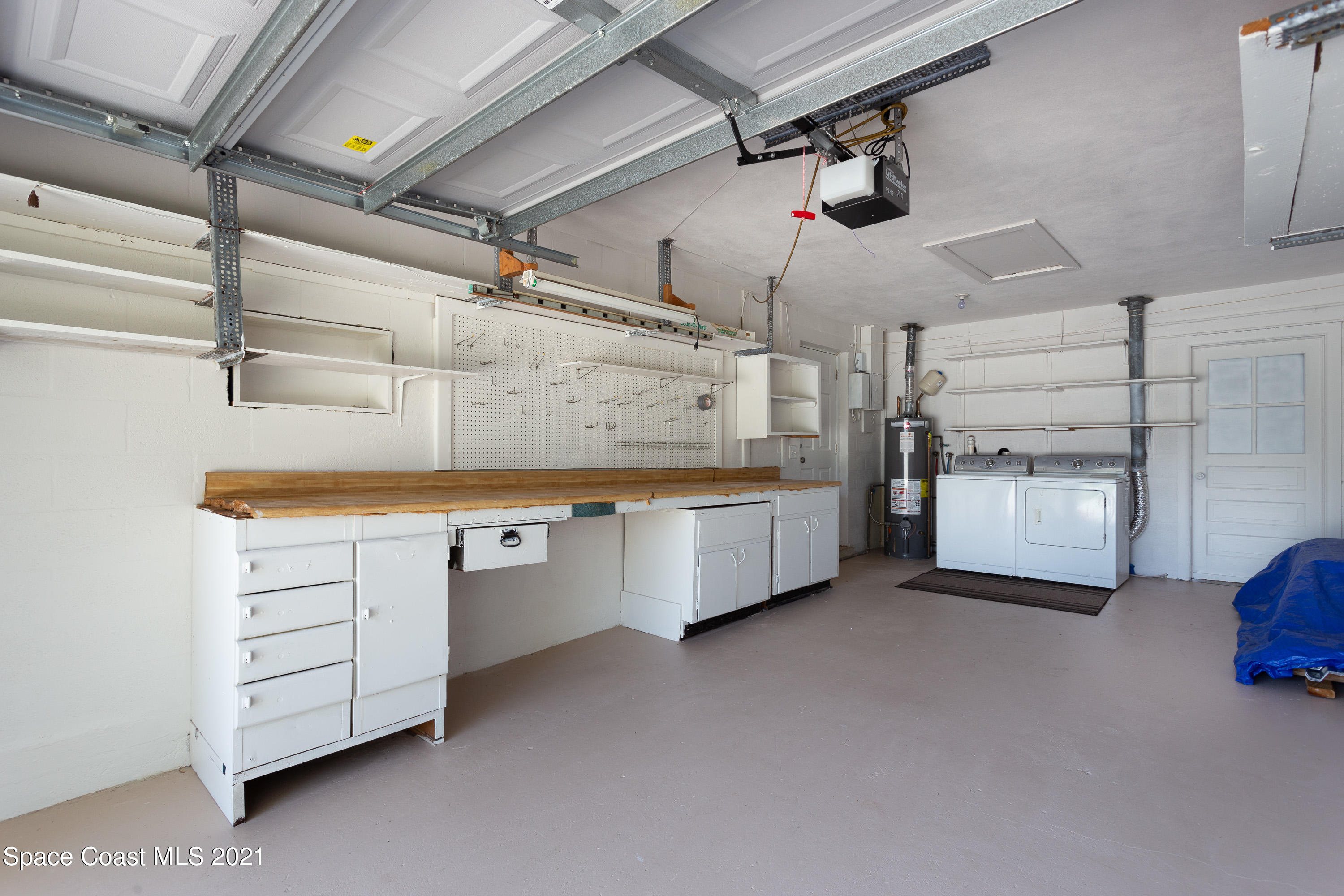 370 Capri Road Cocoa Beach, FL 32931 - Photo 20 of 21 a utility room with cabinets