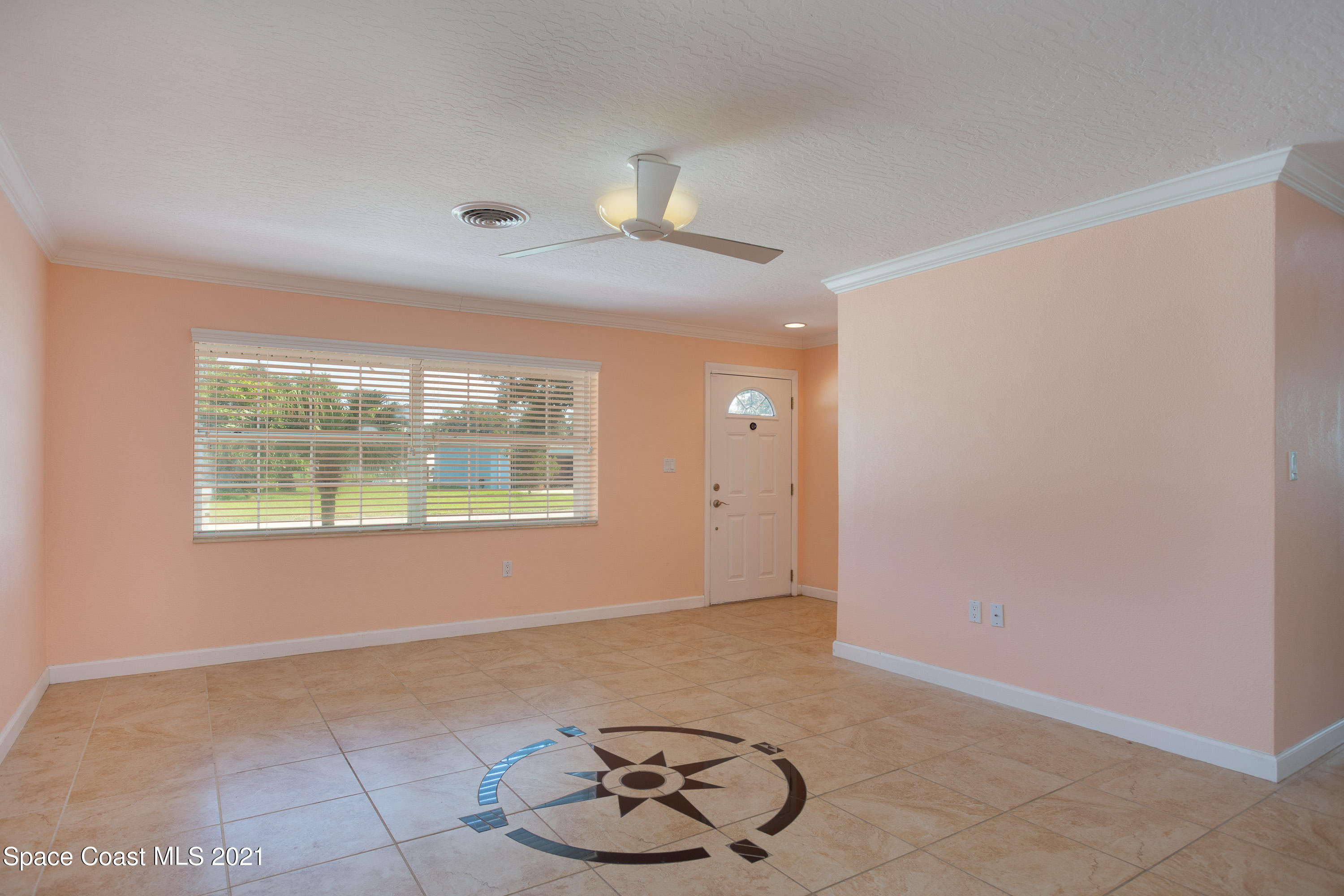 370 Capri Road Cocoa Beach, FL 32931 - Photo 5 of 21 a view of an empty room with a window