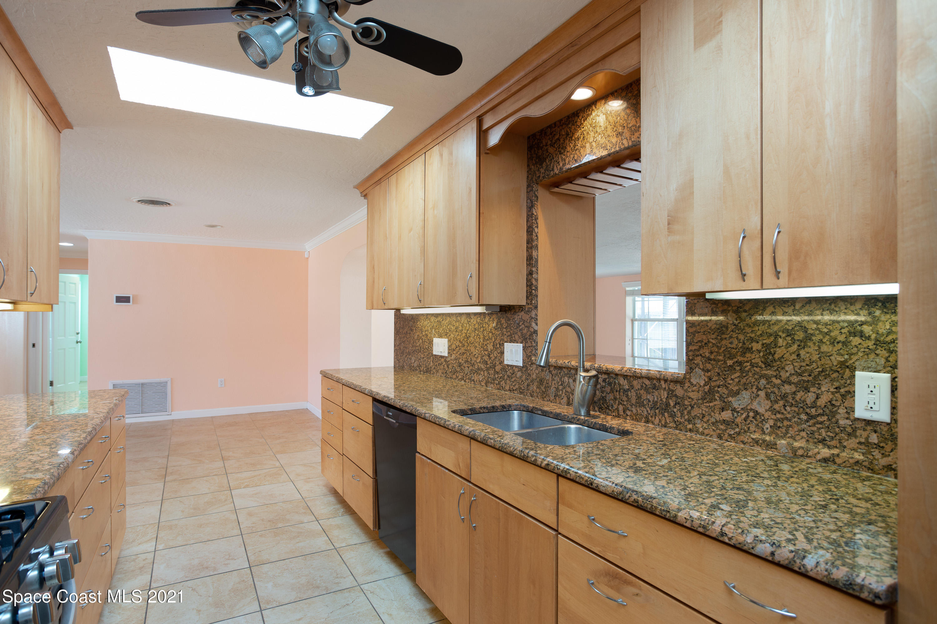 370 Capri Road Cocoa Beach, FL 32931 - Photo 9 of 21 a bathroom with a sink and a mirror