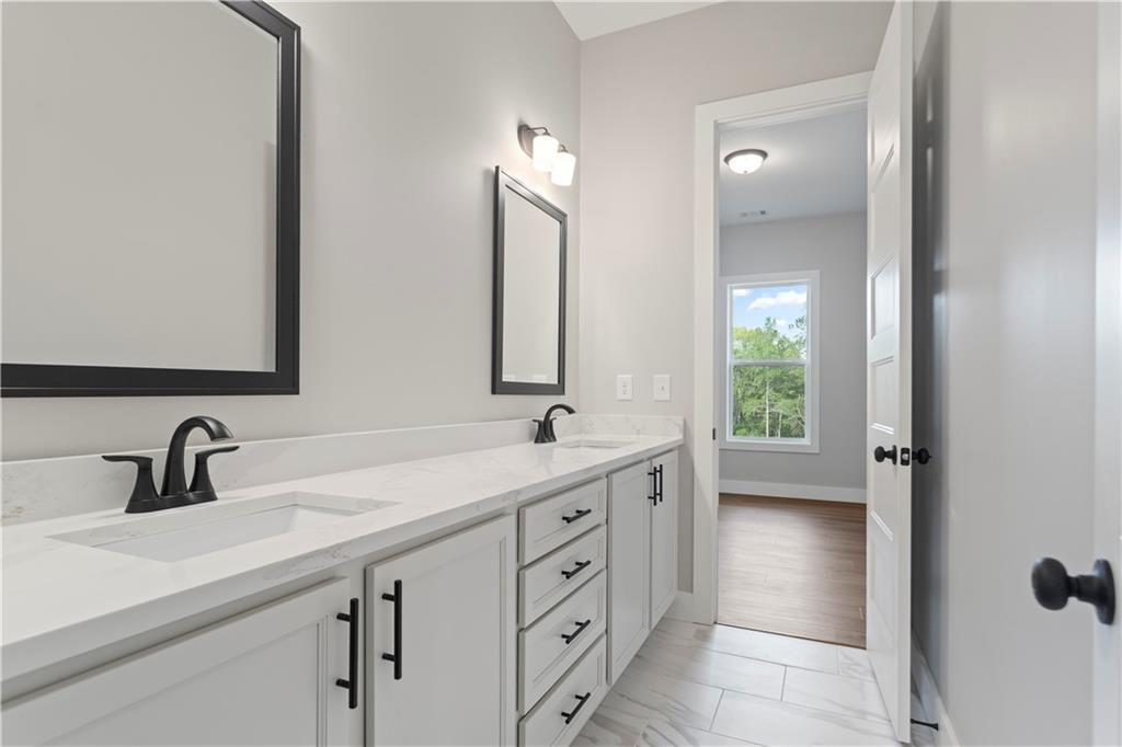 150 Old Sandhill Road Carrollton, GA 30116 - Photo 18 of 36 a bathroom with a double vanity sink mirror and double