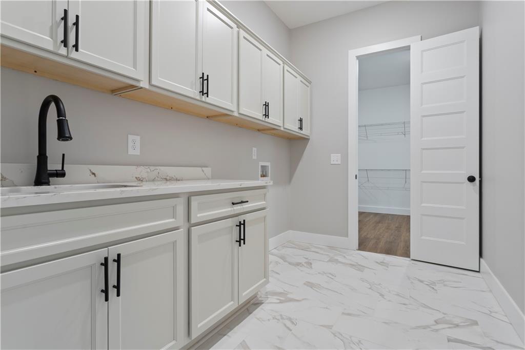 150 Old Sandhill Road Carrollton, GA 30116 - Photo 20 of 36 a close view of a sink and cabinets
