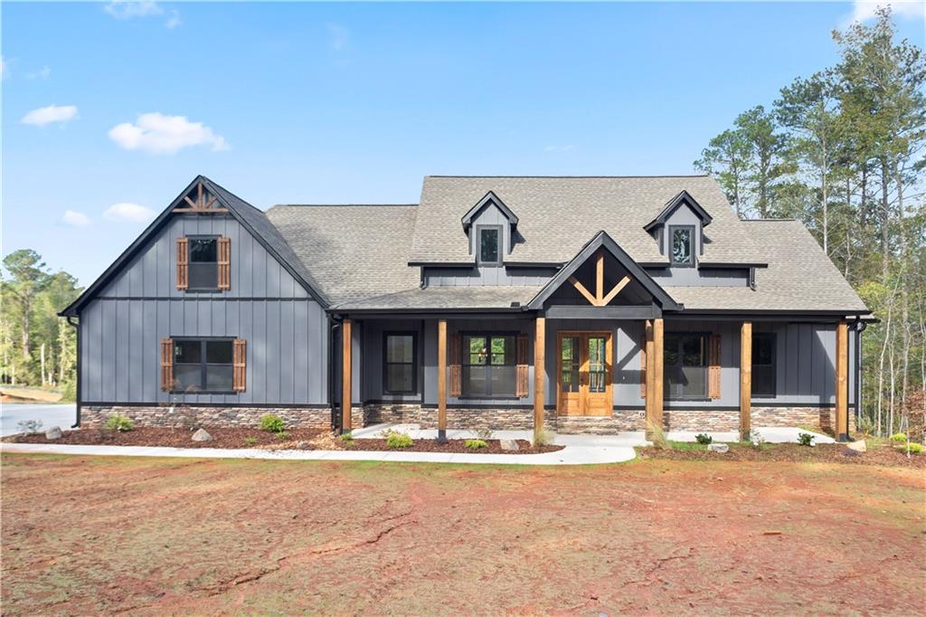 150 Old Sandhill Road Carrollton, GA 30116 - Photo 2 of 36 a front view of a house with a yard
