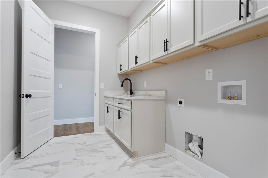 150 Old Sandhill Road Carrollton, GA 30116 - Photo 21 of 36 a kitchen with cabinets and window
