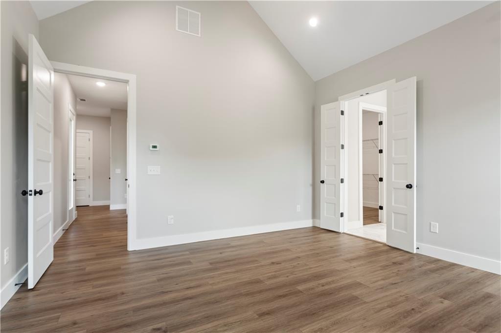 150 Old Sandhill Road Carrollton, GA 30116 - Photo 23 of 36 a view of an empty room with wooden floor