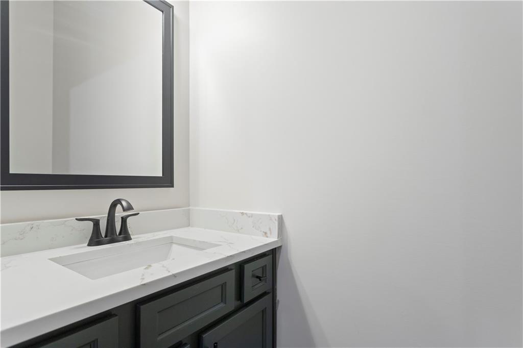150 Old Sandhill Road Carrollton, GA 30116 - Photo 32 of 36 a bathroom with a sink and mirror