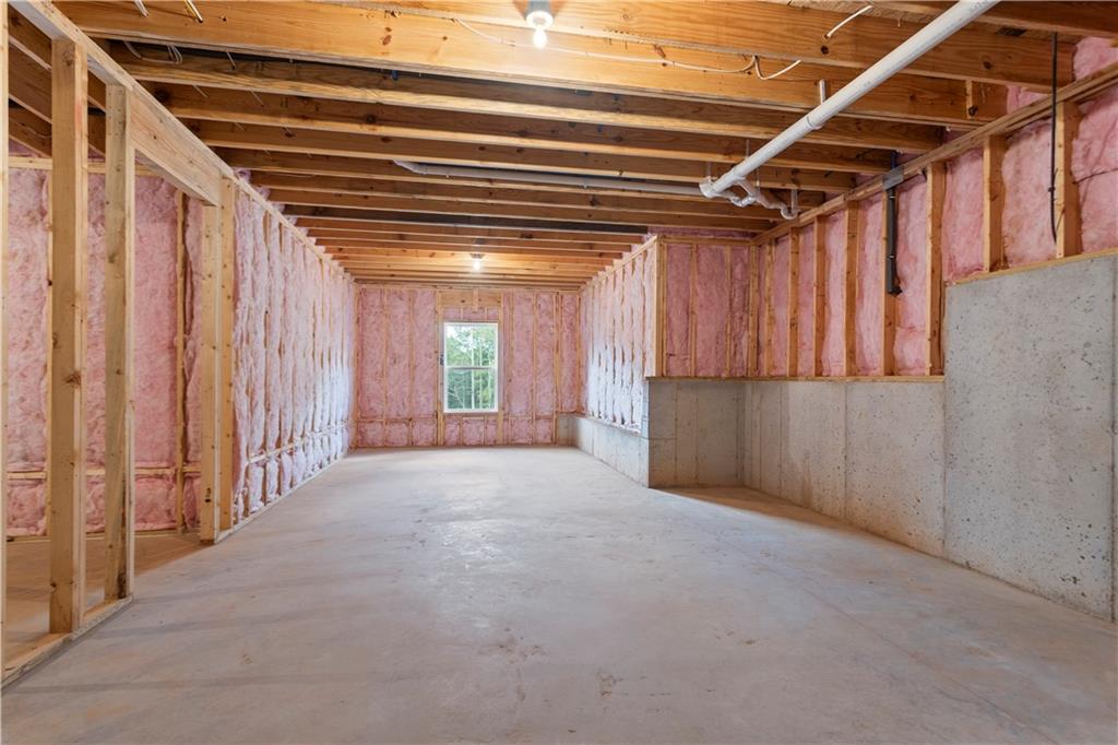 150 Old Sandhill Road Carrollton, GA 30116 - Photo 35 of 36 a view of a hallway with wooden walls and stairs