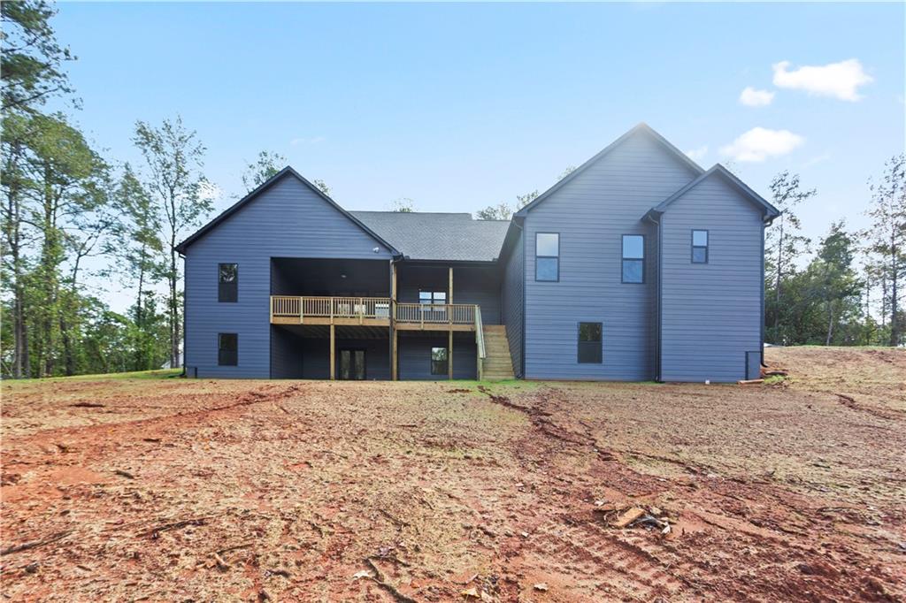 150 Old Sandhill Road Carrollton, GA 30116 - Photo 5 of 36 a front view of a house with a yard