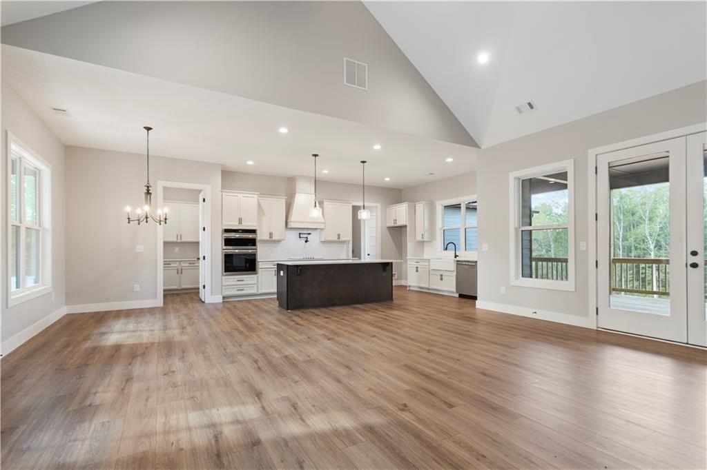 150 Old Sandhill Road Carrollton, GA 30116 - Photo 8 of 36 a view of kitchen with wooden floor and a window