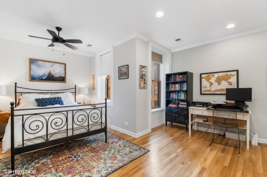 550 West Surf Street, Unit C314 Chicago, IL 60657 - Photo 14 of 21 a view of a workspace with furniture and wooden floor