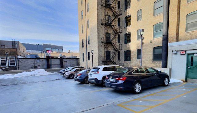 550 West Surf Street, Unit C314 Chicago, IL 60657 - Photo 20 of 21 a car parked in front of a tall building