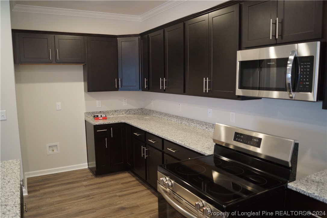 111 Knotts Berry Road Bunnlevel, NC 28323 - Photo 16 of 32 a kitchen with a sink and cabinets