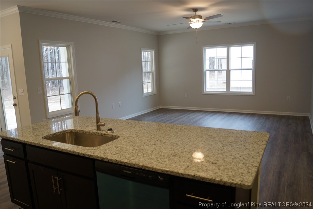 111 Knotts Berry Road Bunnlevel, NC 28323 - Photo 20 of 32 a view of a room with a sink and chandelier