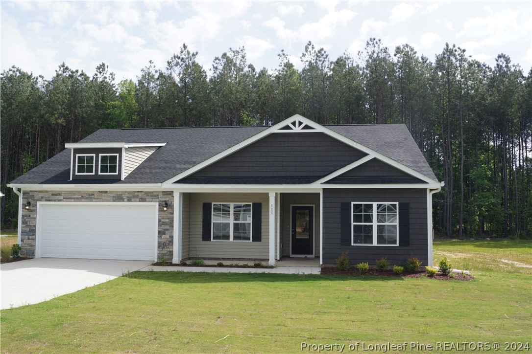 111 Knotts Berry Road Bunnlevel, NC 28323 - Photo 2 of 32 a white house with a large pool in front of it