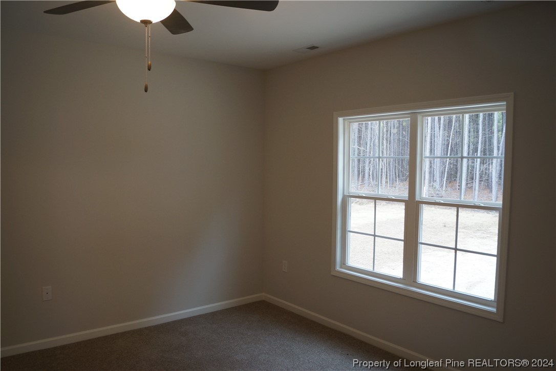 111 Knotts Berry Road Bunnlevel, NC 28323 - Photo 27 of 32 an empty room with a window