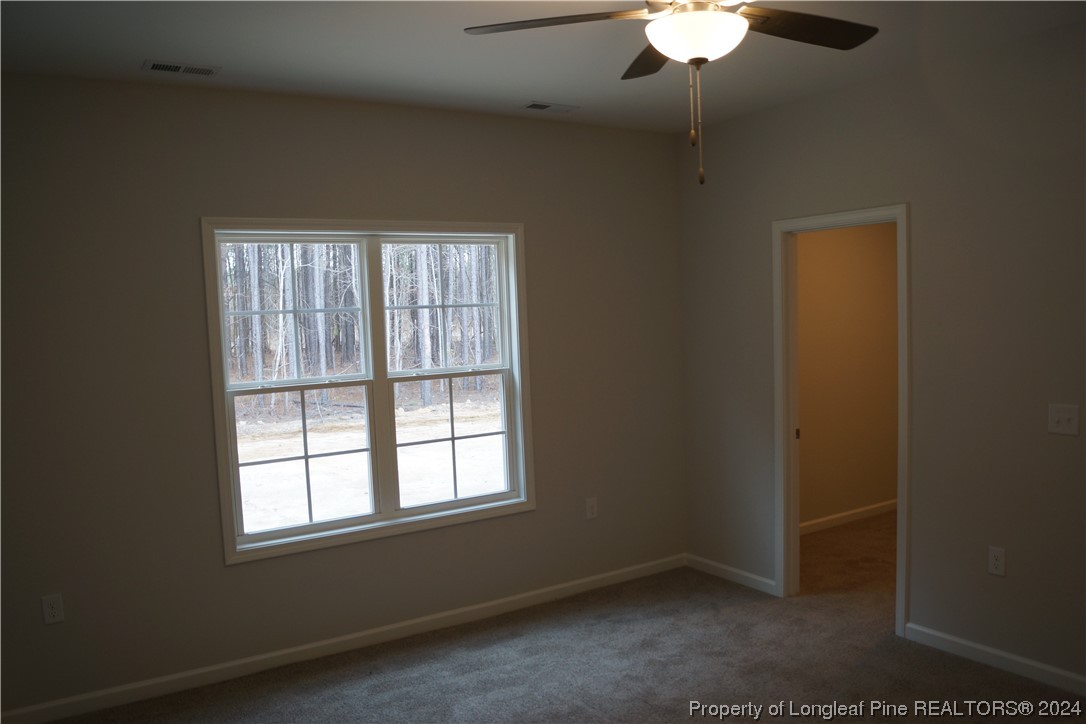 111 Knotts Berry Road Bunnlevel, NC 28323 - Photo 28 of 32 an empty room with a window