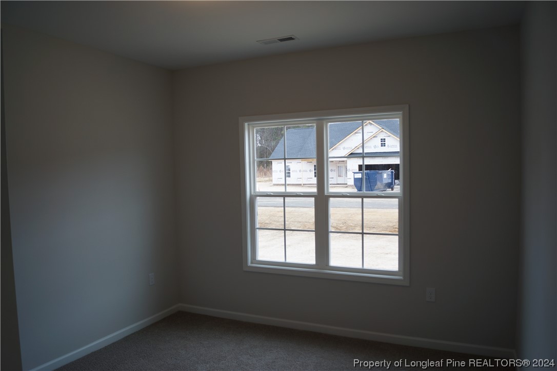 111 Knotts Berry Road Bunnlevel, NC 28323 - Photo 5 of 32 an empty room with a window